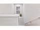 Bright, open staircase with a small plant and window offering natural light at 2634 Sunrise Shores Dr, Kissimmee, FL 34747