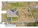 Aerial view of a home with solar panels and a large backyard at 2649 Howland Blvd, Deltona, FL 32738