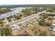 Community overview showcasing homes with solar panels near a lake at 2649 Howland Blvd, Deltona, FL 32738