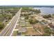 Community overview showcasing homes with solar panels near a lake at 2649 Howland Blvd, Deltona, FL 32738