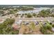 Community overview showcasing homes with solar panels near a lake at 2649 Howland Blvd, Deltona, FL 32738