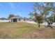 Spacious backyard with a large tree and basketball hoop at 2649 Howland Blvd, Deltona, FL 32738