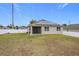 Large backyard with solar panels and a white vinyl fence at 2649 Howland Blvd, Deltona, FL 32738