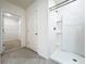 Bathroom with shower, closet, and tile flooring at 2649 Howland Blvd, Deltona, FL 32738