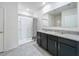 Bathroom with granite countertops, dark cabinets, and a shower/tub combo at 2649 Howland Blvd, Deltona, FL 32738