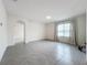 Bright bedroom with gray carpet, neutral walls and a large window at 2649 Howland Blvd, Deltona, FL 32738