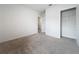 Well-lit bedroom featuring carpet and a walk-in closet at 2649 Howland Blvd, Deltona, FL 32738