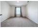 Bright bedroom with carpeted floors and window coverings at 2649 Howland Blvd, Deltona, FL 32738