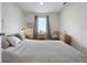 Comfortable bedroom featuring a large bed and side table at 2649 Howland Blvd, Deltona, FL 32738