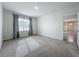 Bedroom featuring gray carpet, neutral walls, and views to other rooms at 2649 Howland Blvd, Deltona, FL 32738
