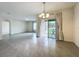Spacious dining area with sliding glass doors and a chandelier at 2649 Howland Blvd, Deltona, FL 32738