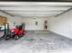 Garage with automatic door opener and floor rug at 2649 Howland Blvd, Deltona, FL 32738