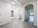 Clean hallway with tile flooring and access to rooms at 2649 Howland Blvd, Deltona, FL 32738