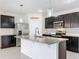 Modern kitchen with granite countertops and stainless steel appliances at 2649 Howland Blvd, Deltona, FL 32738