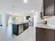 Island kitchen with stainless steel appliances and granite countertops at 2649 Howland Blvd, Deltona, FL 32738