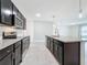 Modern kitchen with granite countertops and stainless steel appliances at 2649 Howland Blvd, Deltona, FL 32738