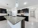 Modern kitchen with granite countertops and stainless steel appliances at 2649 Howland Blvd, Deltona, FL 32738