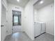 Laundry room with washer, dryer, and overhead shelving at 2649 Howland Blvd, Deltona, FL 32738