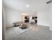 Spacious living area showcasing an open floor plan and kitchen views at 2649 Howland Blvd, Deltona, FL 32738