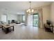 Bright and airy living room with sliding glass doors leading to patio at 2649 Howland Blvd, Deltona, FL 32738