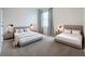 Spacious main bedroom with two beds and neutral tones at 2649 Howland Blvd, Deltona, FL 32738