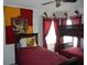 Bedroom featuring twin beds, a bunk bed, themed decor, and a window with red curtains at 2803 Lido Key Ct, Kissimmee, FL 34747