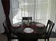 Cozy breakfast nook with table setting provides a relaxing space with views of the pool at 2803 Lido Key Ct, Kissimmee, FL 34747