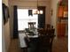 Well-lit dining room with formal table set and adjacent kitchen offers ample space for entertaining at 2803 Lido Key Ct, Kissimmee, FL 34747