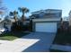 Inviting two-story home with a well-maintained lawn and a spacious two-car garage at 2803 Lido Key Ct, Kissimmee, FL 34747
