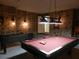 Game room with pool table, foosball table, and stone wall accents at 2803 Lido Key Ct, Kissimmee, FL 34747