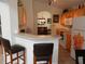 An eat-in kitchen with barstool seating and plenty of counter space at 2803 Lido Key Ct, Kissimmee, FL 34747