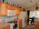 Kitchen with updated appliances, neutral countertops and light colored cabinetry at 2803 Lido Key Ct, Kissimmee, FL 34747