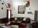 A comfy living room space showcasing dark sofas, themed décor, and accent lighting at 2803 Lido Key Ct, Kissimmee, FL 34747
