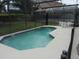 Relaxing pool area with screened enclosure and ample patio space for outdoor entertaining at 2803 Lido Key Ct, Kissimmee, FL 34747