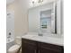 Bathroom with dark vanity, tub and shower at 2959 Arranmore Dr, Ormond Beach, FL 32174