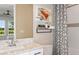 ' bathroom with white vanity and fun decor at 2959 Arranmore Dr, Ormond Beach, FL 32174