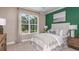 Bedroom with green accent wall and natural light at 2959 Arranmore Dr, Ormond Beach, FL 32174