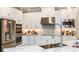 Modern kitchen with white cabinets and stainless steel appliances at 2971 Arranmore Dr, Ormond Beach, FL 32174