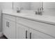 This is a bathroom with a double sink vanity, white shaker cabinets, and modern fixtures at 2975 Arranmore Dr, Ormond Beach, FL 32174