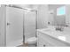 This is a bathroom with a shower, vanity, and white tile backsplash at 2975 Arranmore Dr, Ormond Beach, FL 32174