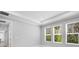 Bedroom with a tray ceiling, lots of natural light, and neutral walls at 2975 Arranmore Dr, Ormond Beach, FL 32174