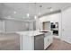 Open-concept kitchen with a large island, stainless steel appliances, and abundant storage space at 2975 Arranmore Dr, Ormond Beach, FL 32174