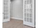 Office with French doors and neutral decor, perfect for a home office or study at 2975 Arranmore Dr, Ormond Beach, FL 32174