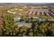 Aerial view of community building and surrounding landscape at 3050 Pirates Retreat Ct # 303, Kissimmee, FL 34747