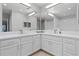 Modern bathroom with double vanity, quartz countertop, and updated fixtures at 3050 Pirates Retreat Ct # 303, Kissimmee, FL 34747