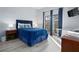 Bedroom with a queen-size bed and access to balcony at 3050 Pirates Retreat Ct # 303, Kissimmee, FL 34747