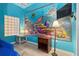 Themed bedroom with ocean mural and ample space at 3050 Pirates Retreat Ct # 303, Kissimmee, FL 34747
