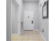 Simple entryway with tiled floors and a white door at 3050 Pirates Retreat Ct # 303, Kissimmee, FL 34747