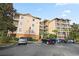 Three-story building with ample parking and surrounding landscaping at 3050 Pirates Retreat Ct # 303, Kissimmee, FL 34747