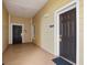 Building hallway with two dark brown doors and light beige walls at 3050 Pirates Retreat Ct # 303, Kissimmee, FL 34747